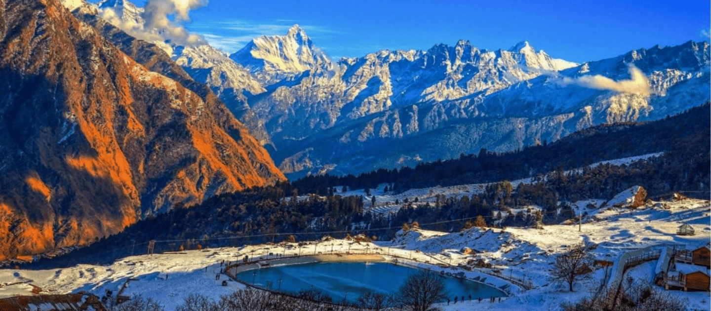 Auli snow slopes and view of Nanda Devi mountain peak in Uttarakhand