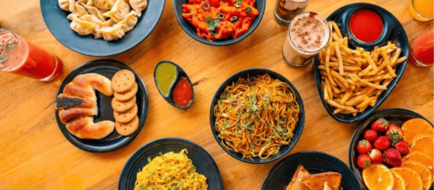 A plate of traditional Himachali food, including Tudkiya Bhat and Sidu, a top local dish.