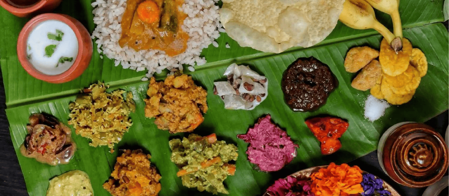 A traditional Kerala Sadya meal served on a banana leaf, a top local dish to try in Kochi.