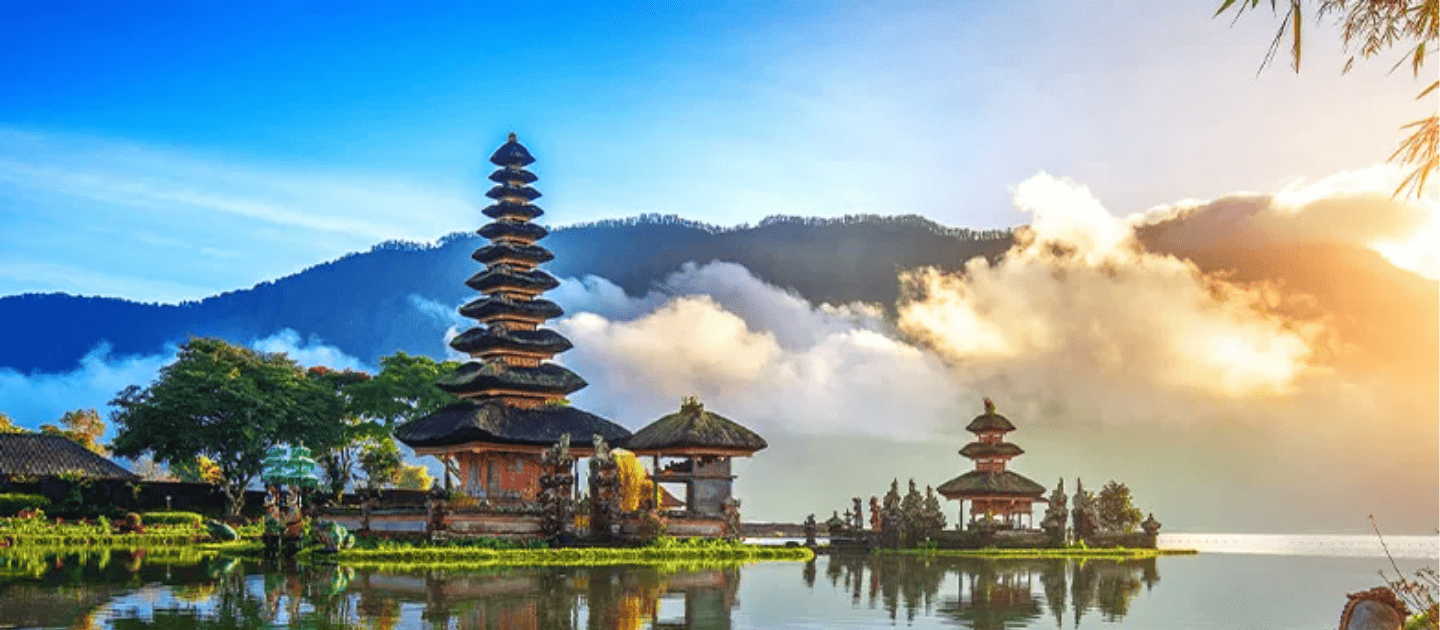 Scenic view of the iconic Pura Ulun Danu Beratan water temple on a lake in Bali, Indonesia, surrounded by misty mountains