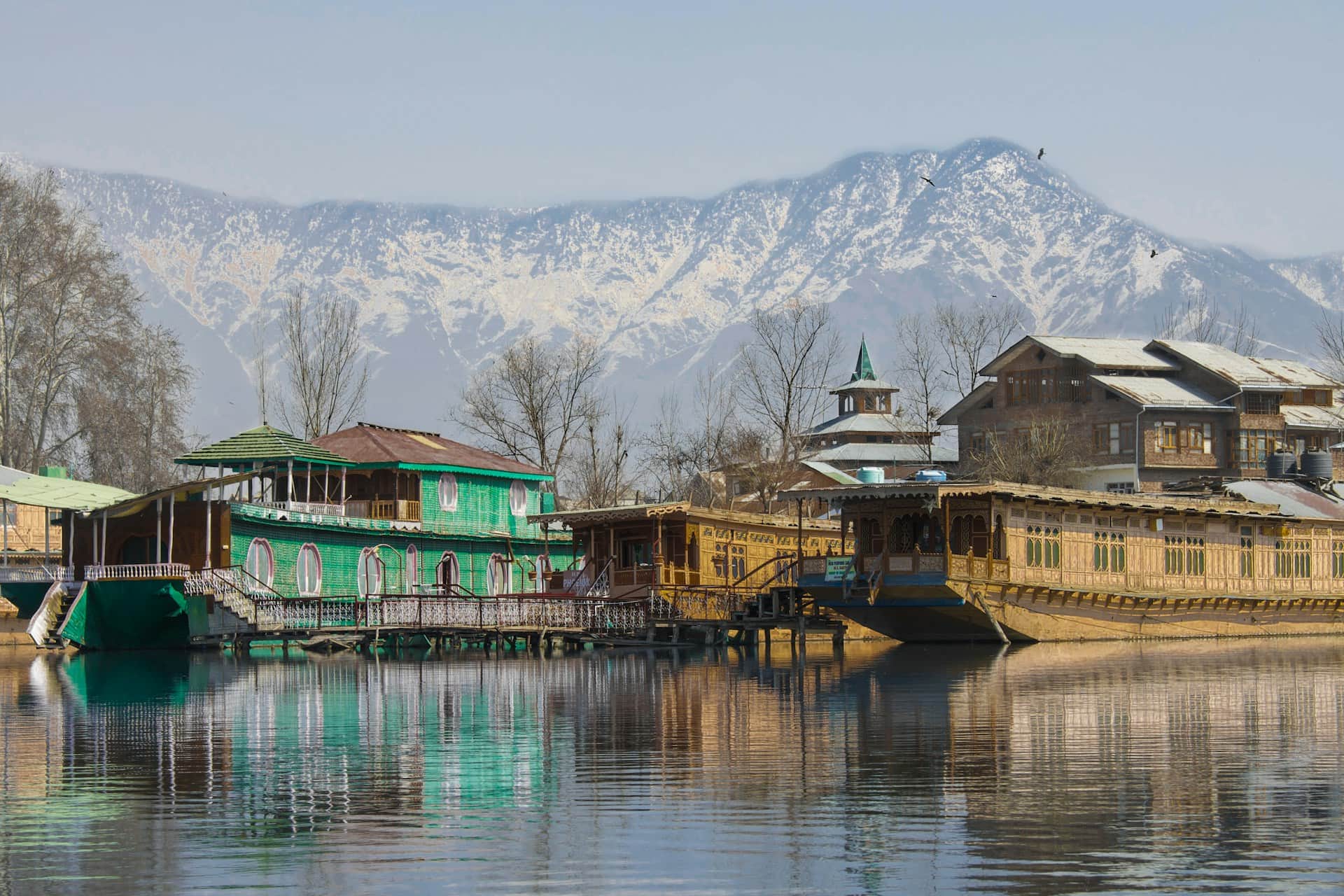 Dal Lake Houseboats View in Srinagar Kashmir Houseboats on Dal Lake in Srinagar with mountains in Kashmir