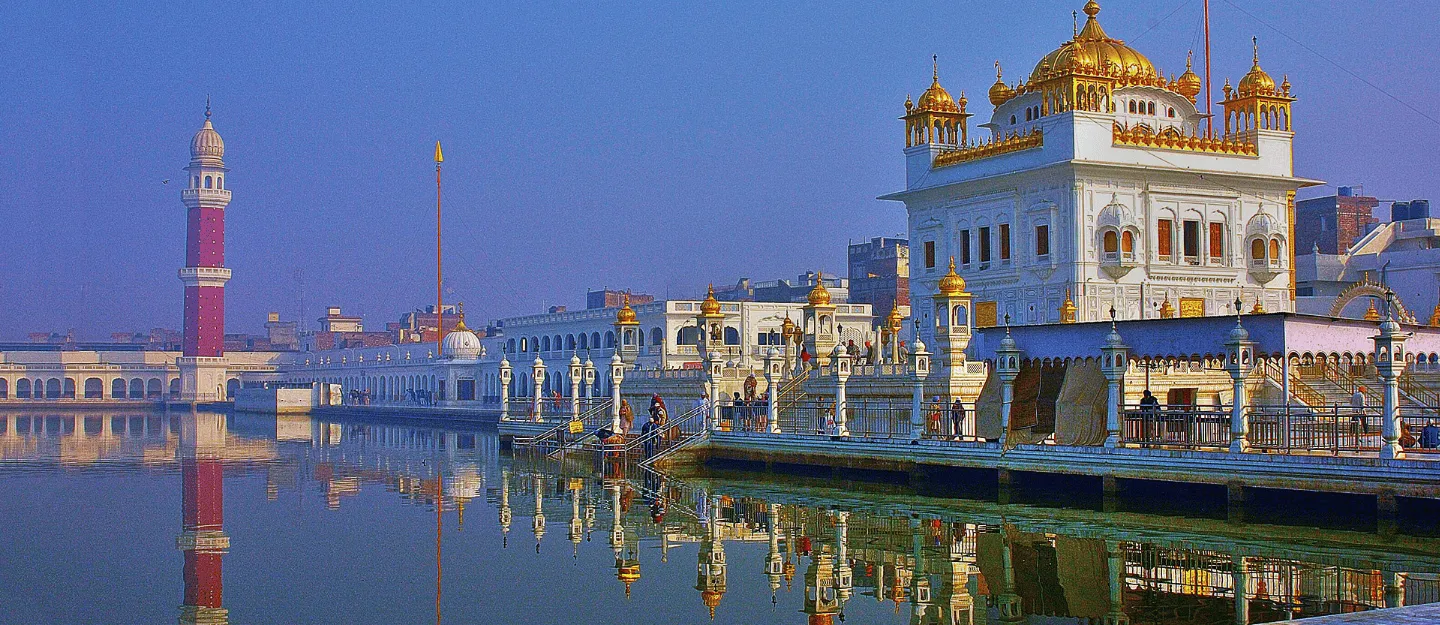 Golden Temple Amritsar Beautiful Sunrise View with Reflection Golden Temple Amritsar Punjab India with holy sarovar reflection at sunrise